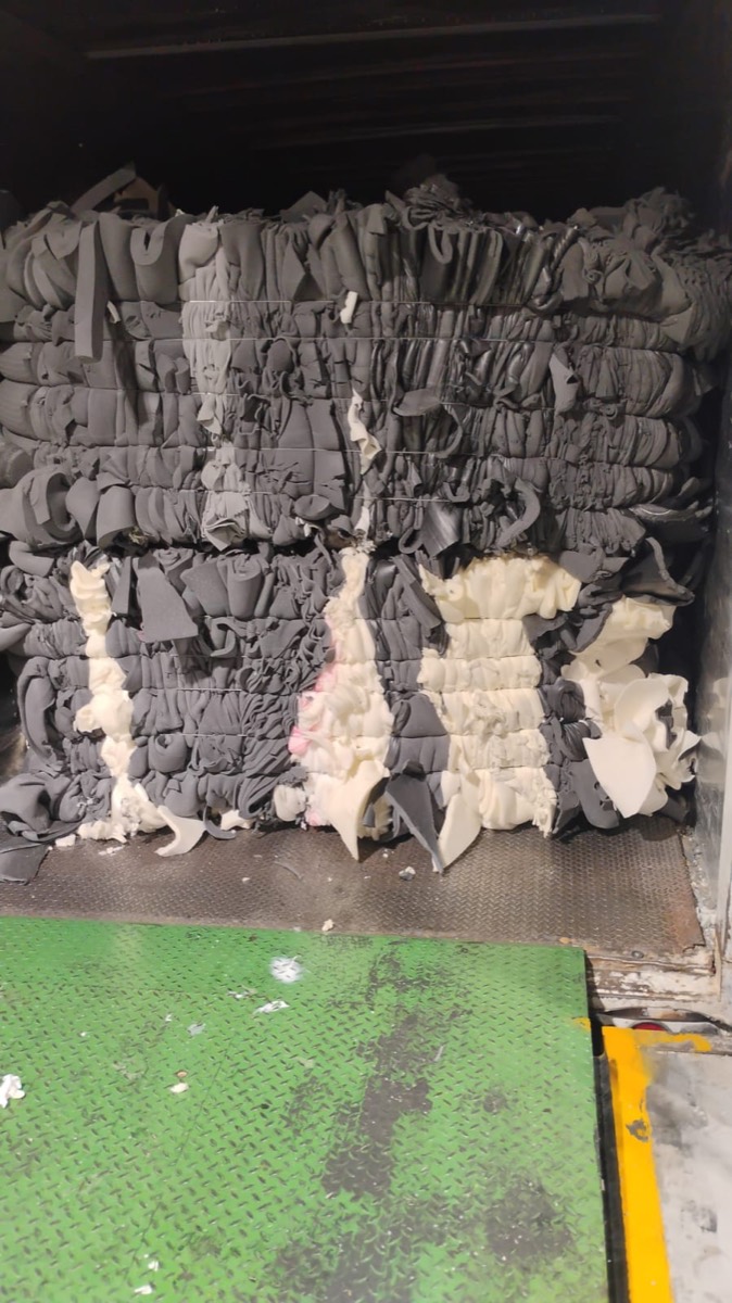 Compressed foam bales inside a trailer